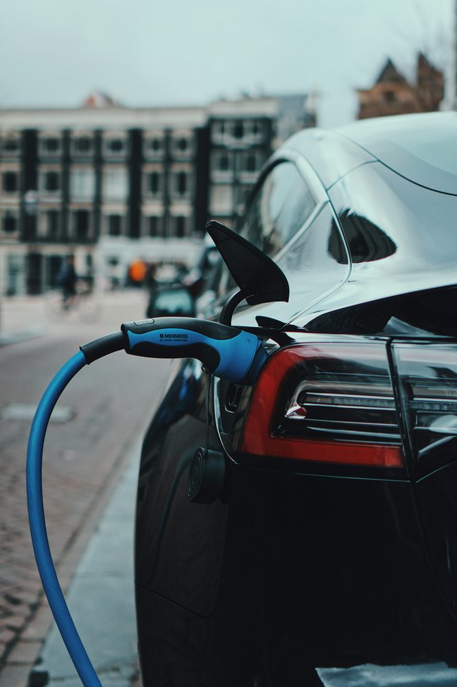 Close-up of a Tesla charge port with the connector engaged
